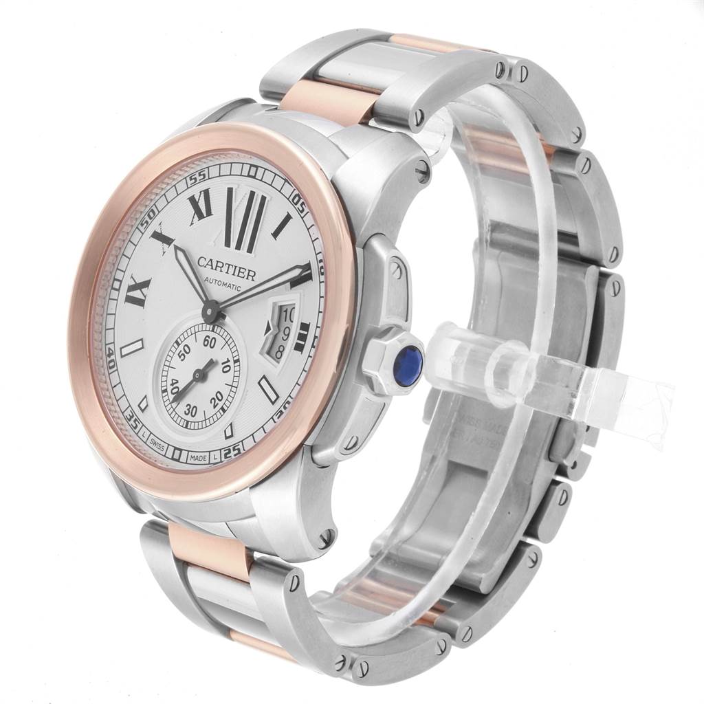 The image shows a Calibre de Cartier watch by Cartier at a side angle, highlighting the face, bezel, crown, and part of the bracelet.