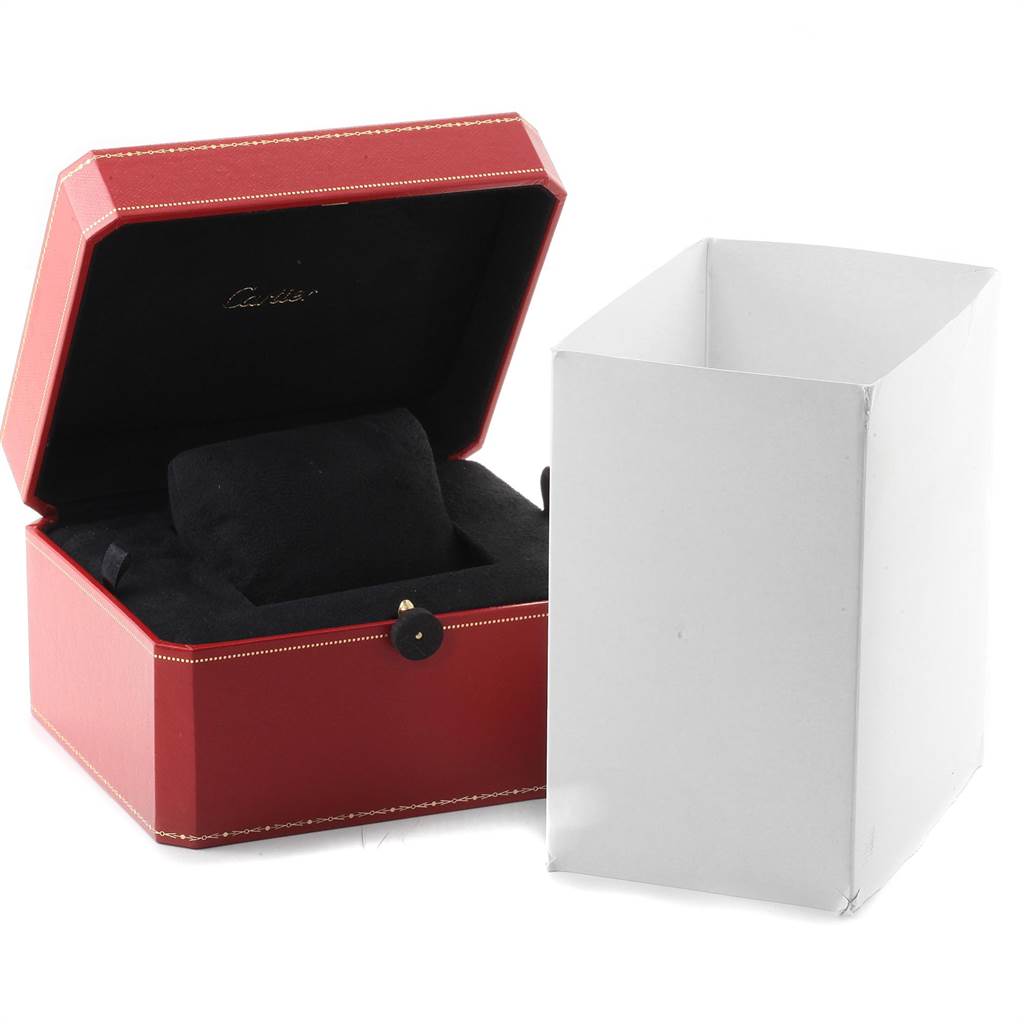 The image shows an open red Cartier watch box for the Calibre de Cartier model, along with its white outer packaging.
