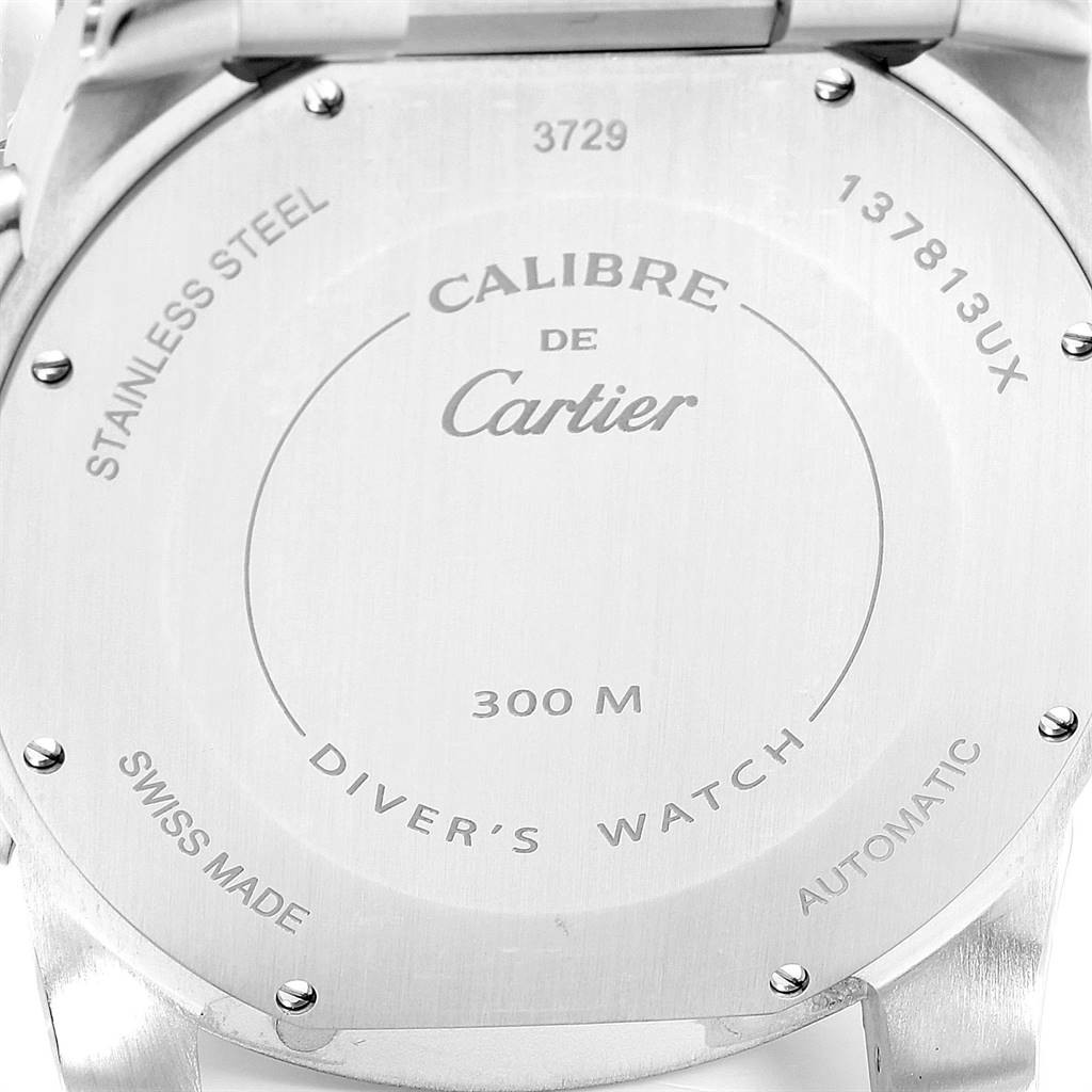 This image shows the stainless steel back case of the Calibre de Cartier model by Cartier, indicating it is a diver's watch with 300M water resistance.