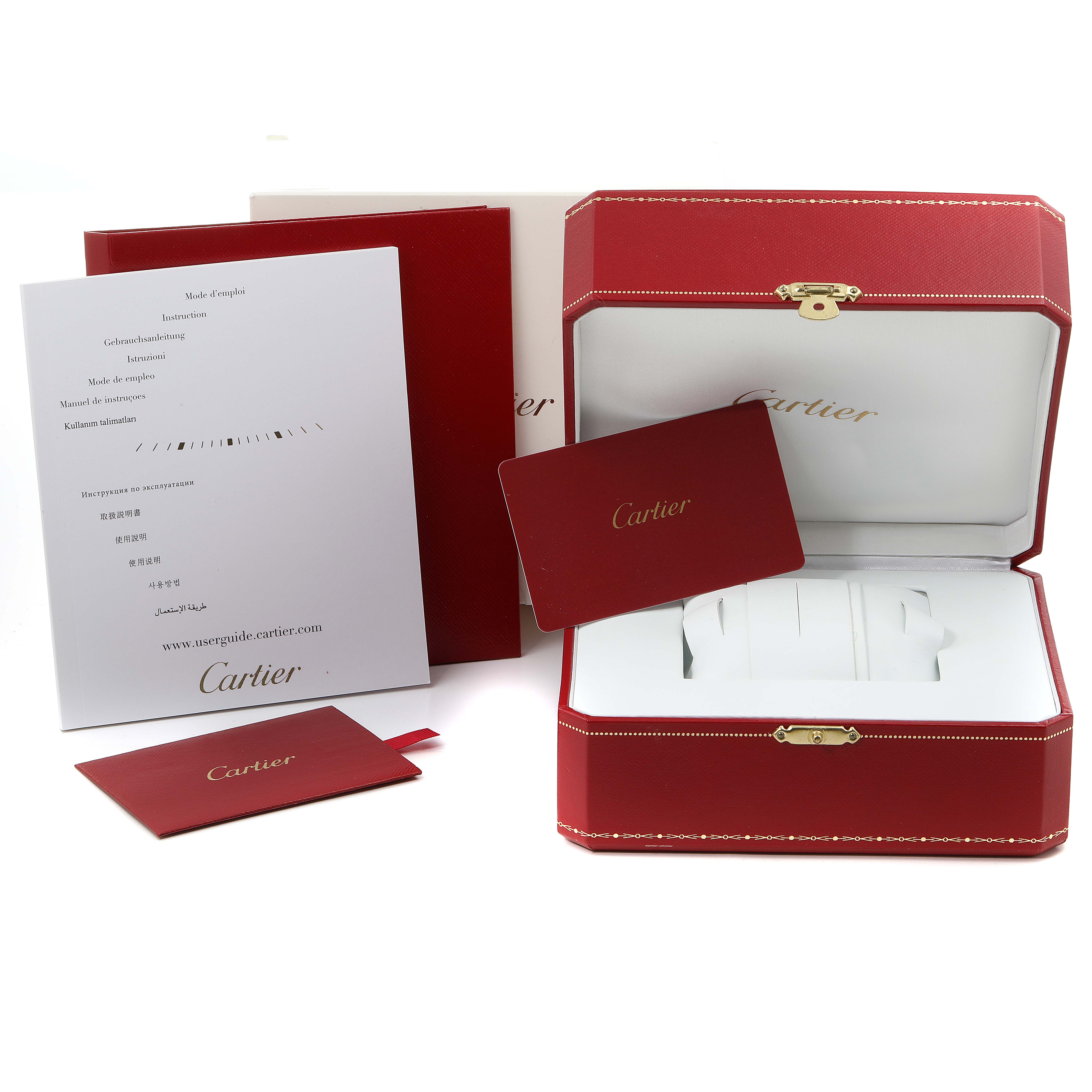 This image shows the packaging, documentation, and warranty card for a Calibre de Cartier watch by Cartier.