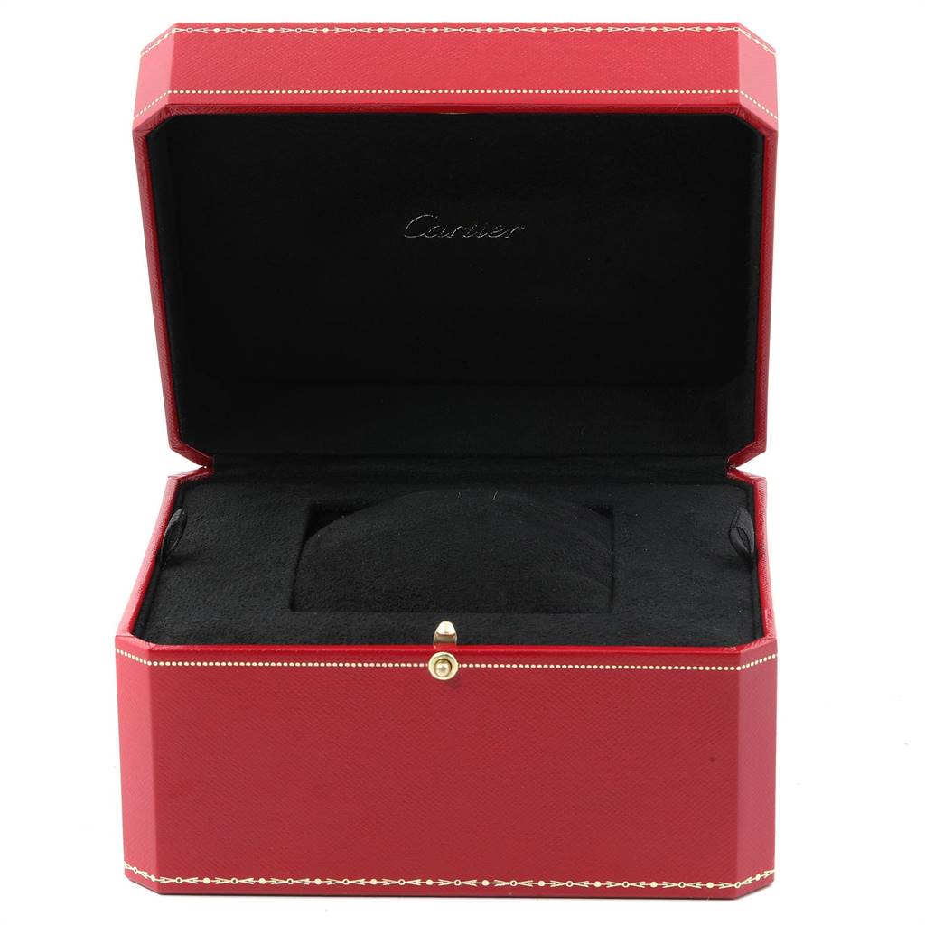 The image shows an open red Cartier box designed for the Calibre de Cartier model, displaying the interior with black cushioning.