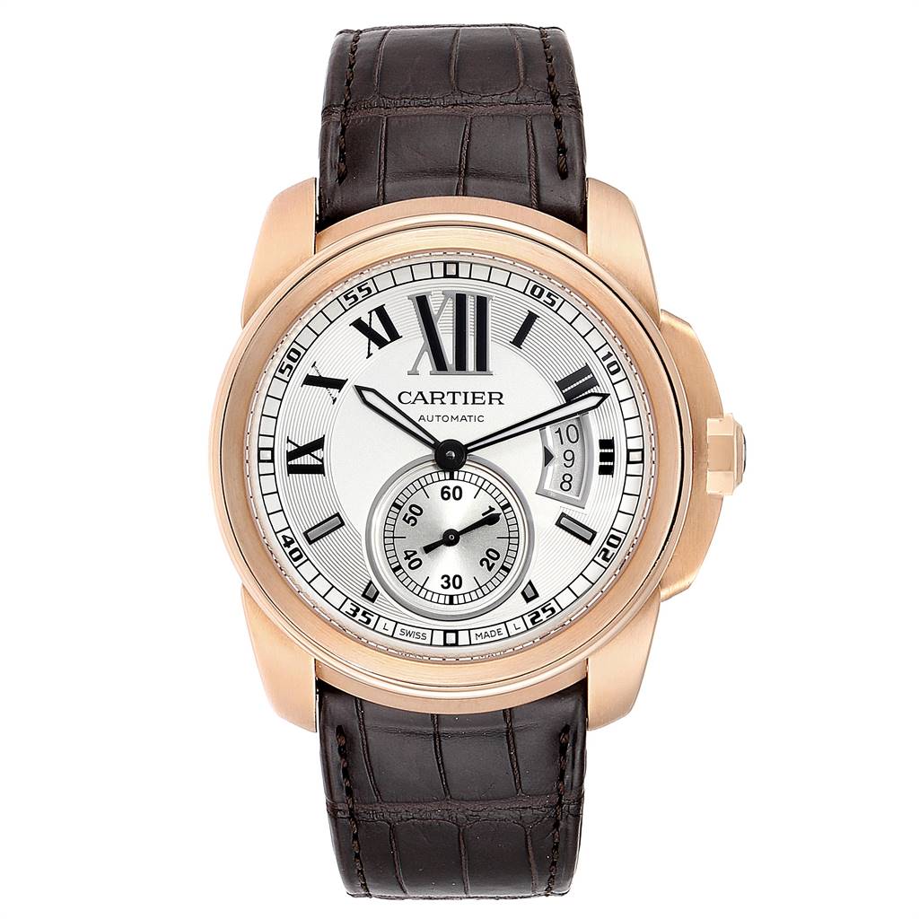 The image shows a front view of a Calibre de Cartier watch by Cartier, featuring a leather strap and a detailed dial.
