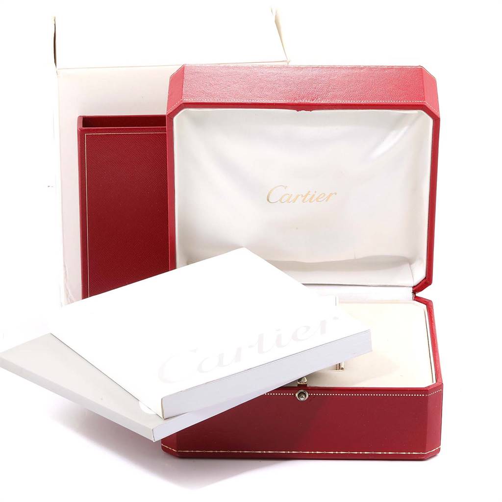 The image shows a Cartier Calibre de Cartier W7100056 Men
s Stainless Steel Black Dial W7100056 Men
s Stainless Steel Black Dial watch box and booklet from an angled, front view.