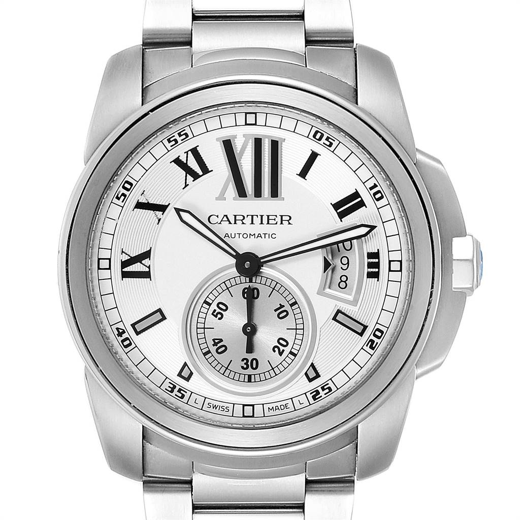 The image shows a front view of the Calibre de Cartier watch by Cartier, highlighting its dial, hands, and bracelet.