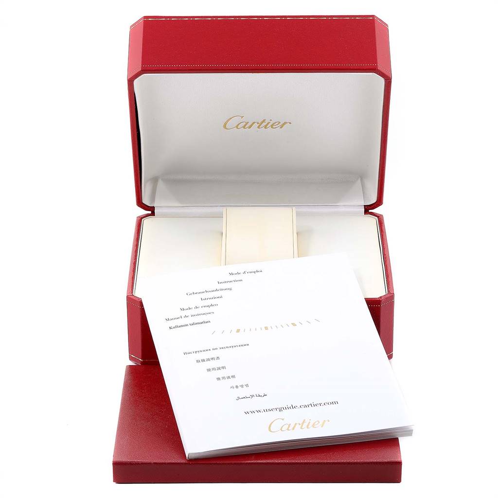The image shows an open Cartier watch box with instructions, designed for the Calibre de Cartier model.