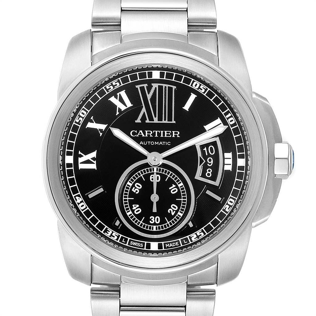 The image shows a front view of a Calibre de Cartier model by Cartier, highlighting its black dial, Roman numerals, sub-dial, and bracelet.