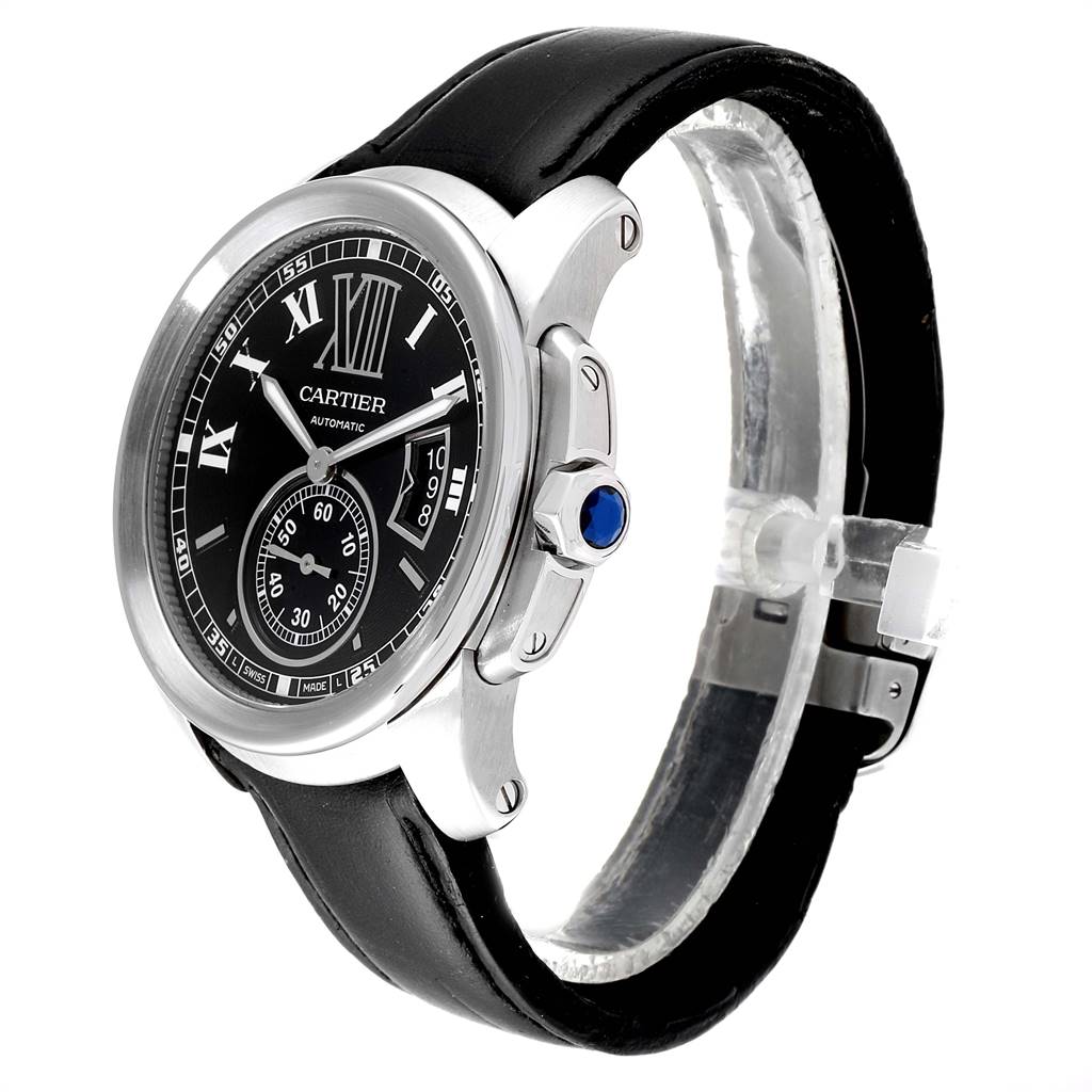 The image shows a Calibre de Cartier watch by Cartier from an angled front view, featuring the watch dial, crown, and leather strap.