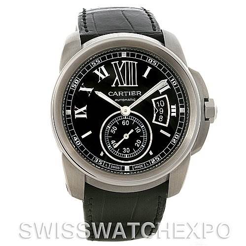 The image shows a frontal view of a Calibre de Cartier watch by Cartier, featuring a black dial with Roman numerals and a date display.