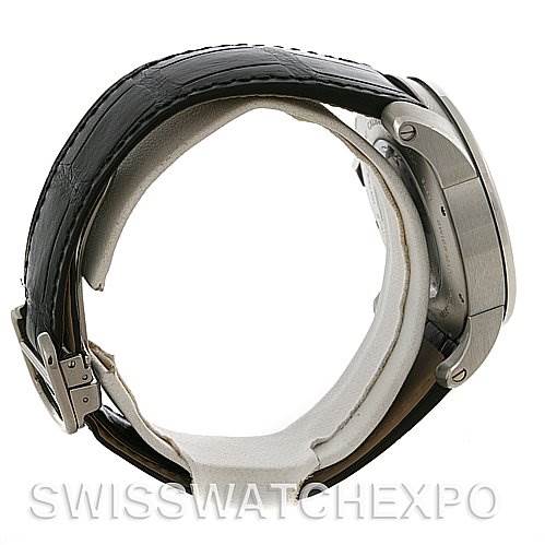 The image shows a side angle of a Calibre de Cartier watch by Cartier, focusing on the case, strap, and clasp.