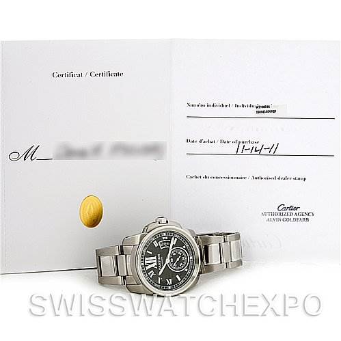 The image shows a Calibre de Cartier model by Cartier placed with its certificate and documentation, viewed from the front.