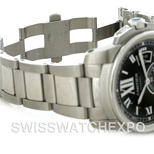 The image shows a side view of a Calibre de Cartier watch by Cartier, focusing on the stainless steel bracelet and partially on the dial.