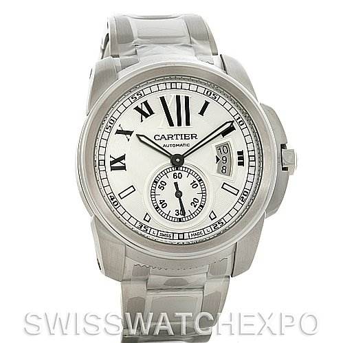 The image shows a front view of the Calibre de Cartier watch by Cartier, displaying its face, dial, hands, and date window.