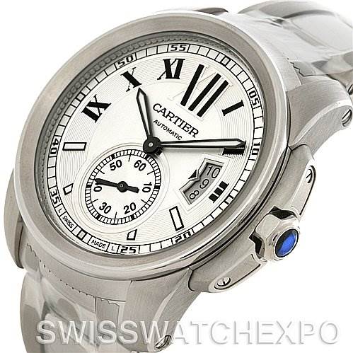 The image shows a Calibre de Cartier watch by Cartier at a slight angle, featuring the face with Roman numerals, subdial, and crown with blue cabochon.