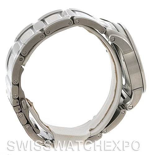 The image shows a side-angle view of the Calibre de Cartier model by Cartier, highlighting its metal bracelet and case.