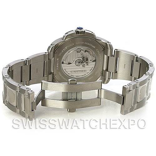 The image shows the back case and bracelet of the Calibre de Cartier watch by Cartier, featuring an open deployant clasp.