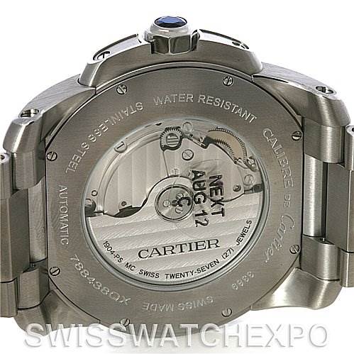 The image shows the back view of the Calibre de Cartier watch by Cartier, highlighting the automatic movement and engraved details.