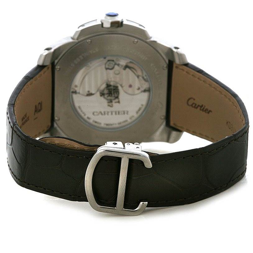 The image shows the back view of a Calibre de Cartier watch by Cartier, highlighting the leather strap and clasp.