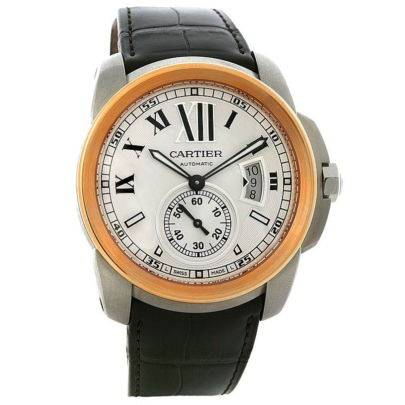 The image shows a front view of a Calibre de Cartier watch by Cartier, highlighting the face, bezel, and strap.