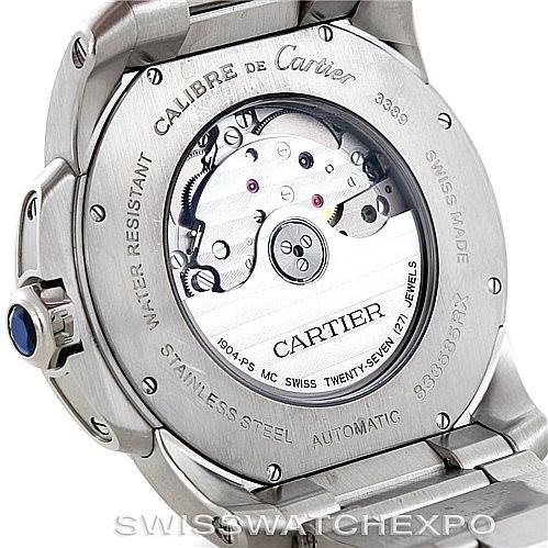 This image shows the back view of a Calibre de Cartier watch by Cartier, highlighting its automatic movement and stainless steel case.