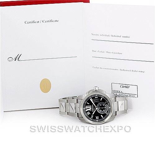 The image shows a Calibre de Cartier watch by Cartier along with its certificate of authenticity.