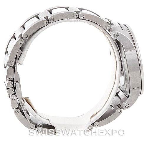 The image shows a side view of the Calibre de Cartier watch by Cartier, highlighting its stainless steel bracelet and case.