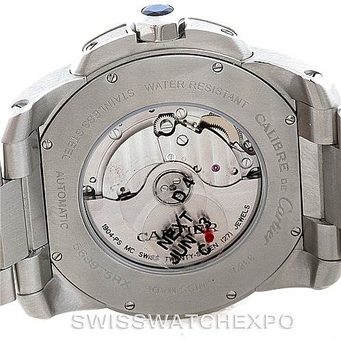 The image shows the back of a Calibre de Cartier watch by Cartier, highlighting the movement and case-back details from a rear angle.