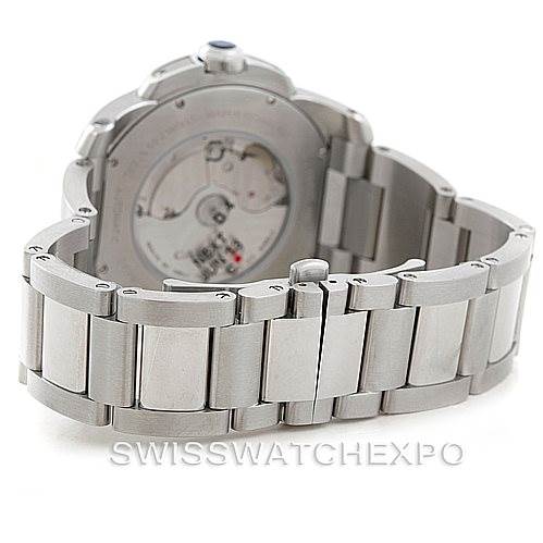 The image shows the back and side view of a Calibre de Cartier watch by Cartier, highlighting its stainless steel bracelet and exhibition case back.