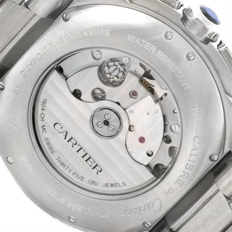The image shows the back view of the Calibre de Cartier watch by Cartier, displaying its exposed automatic movement mechanism.