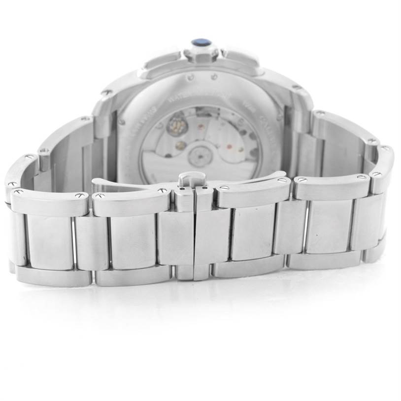 The image shows the back view of the Calibre de Cartier watch by Cartier, highlighting the bracelet, case back, and movement.