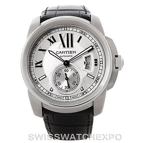 The image shows a frontal view of a Calibre de Cartier watch by Cartier, displaying its face, bezel, and leather strap.