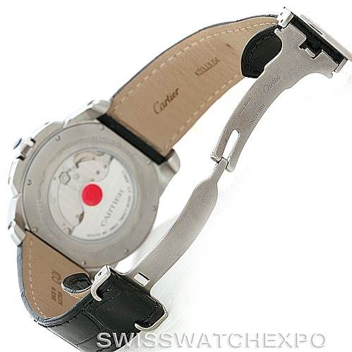 The image shows the back view of the Calibre de Cartier watch by Cartier, highlighting the movement and leather strap with the deployment clasp.