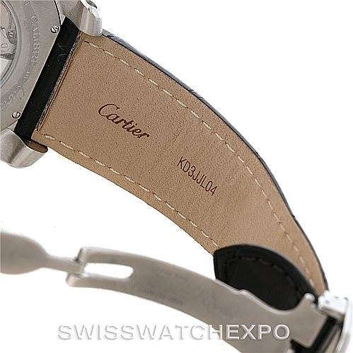 The image shows the underside of the band and clasp of a Calibre de Cartier watch by Cartier.