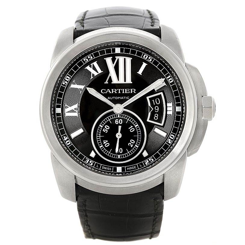 The image shows a frontal view of the Calibre de Cartier model by Cartier, highlighting its black dial, Roman numerals, and leather strap.