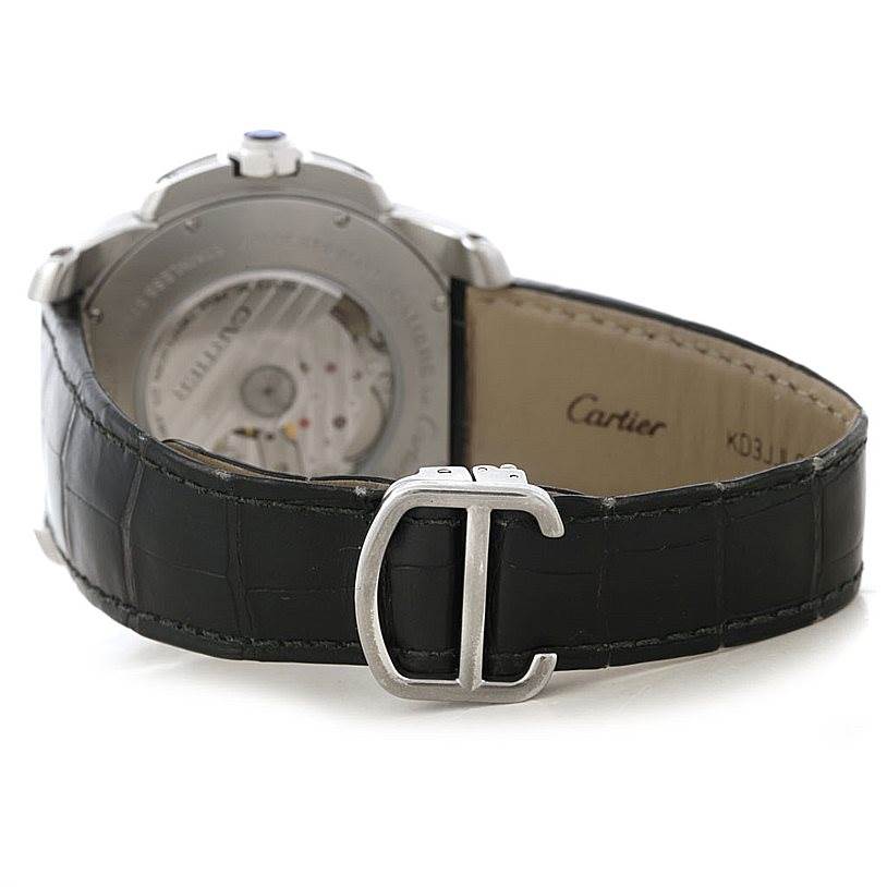This image shows the rear view of the Calibre de Cartier watch by Cartier, highlighting its back cover, strap, and buckle.