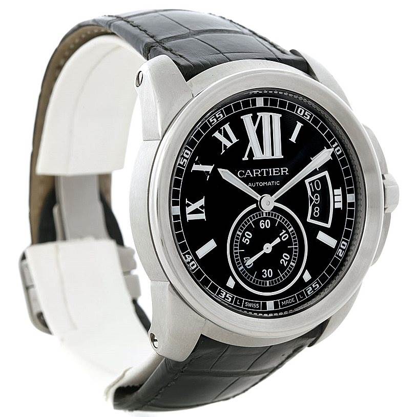 The Calibre de Cartier watch by Cartier is shown at a slight angle, displaying its face, bezel, and black leather strap.