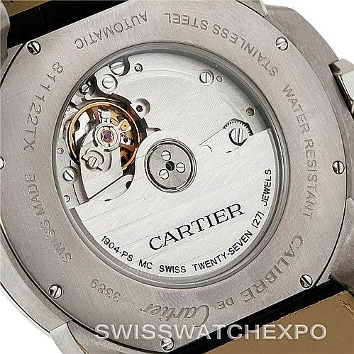 The image shows the back of a Calibre de Cartier watch by Cartier, highlighting its automatic movement and engravings.