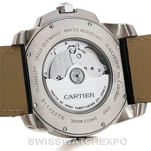 The image shows the back case of a Calibre de Cartier watch by Cartier, highlighting the automatic movement and engravings.