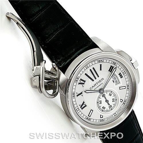 The image shows a side and front view of the Calibre de Cartier watch by Cartier, featuring its face and buckle.
