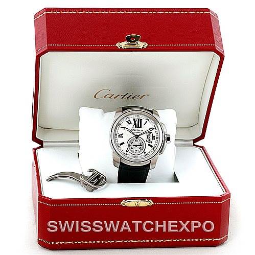 The image shows a Calibre de Cartier watch by Cartier in an open red Cartier box, with a visible watch face and a black strap.