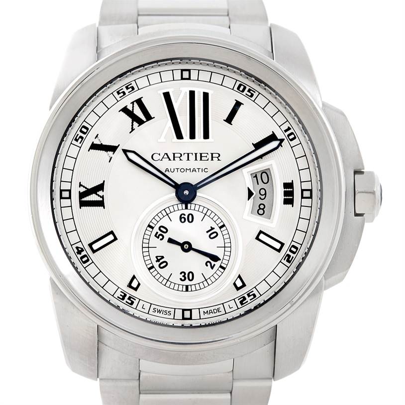 The image shows a front view of a Calibre de Cartier watch by Cartier, showcasing its dial, hour markers, hands, and date window.