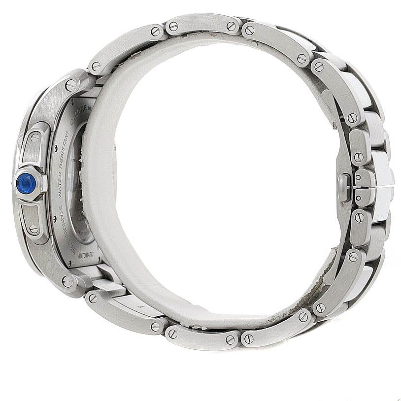This side view of the Calibre de Cartier watch by Cartier shows the crown, case back, and metal bracelet links.