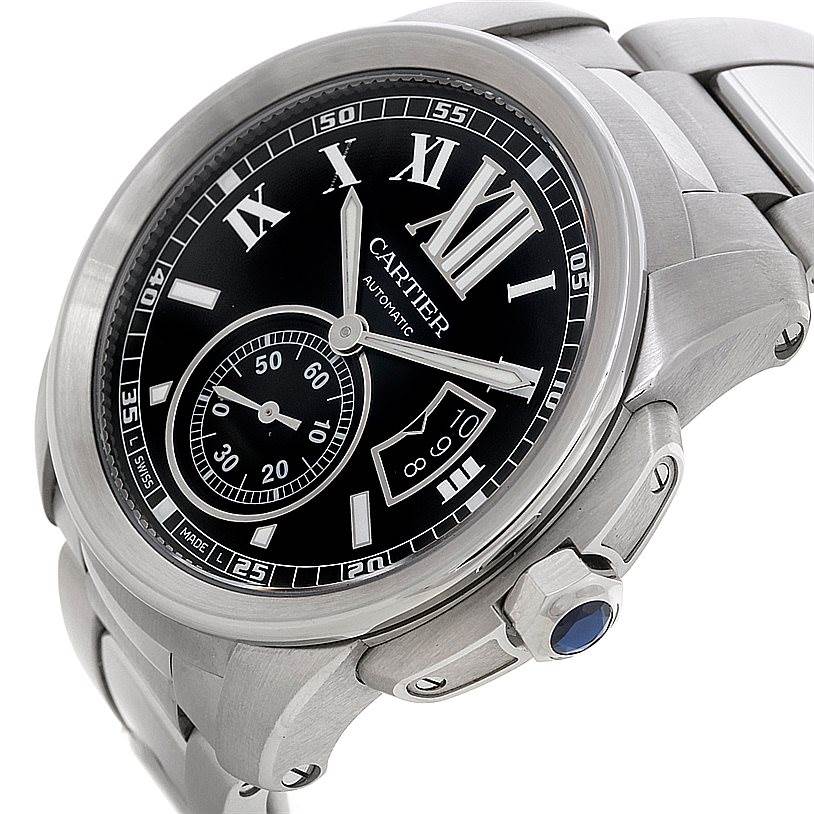 The Calibre de Cartier watch by Cartier is shown at an angled view, highlighting the face, dial, crown, and part of the bracelet.