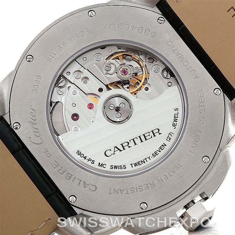 The image shows the back view of the Calibre de Cartier by Cartier, highlighting its intricate movement and internal mechanics.
