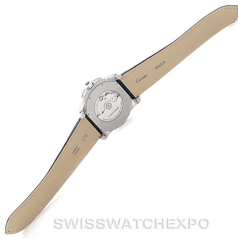 The image shows the back view of the Calibre de Cartier watch by Cartier, highlighting the movement mechanism and leather straps.