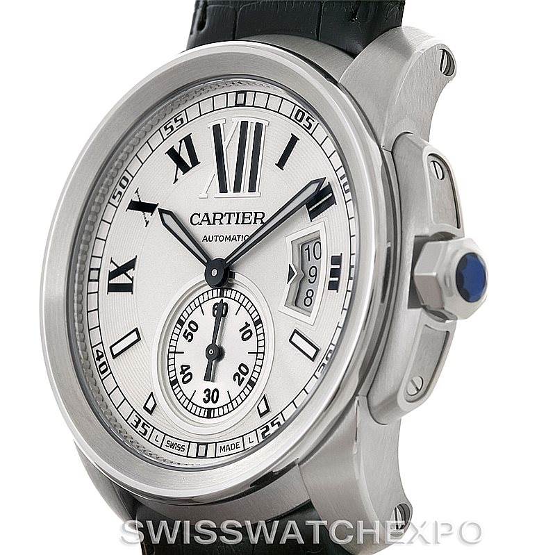 The image shows a close-up side view of the Calibre de Cartier watch by Cartier, highlighting its dial, crown, and bezel.