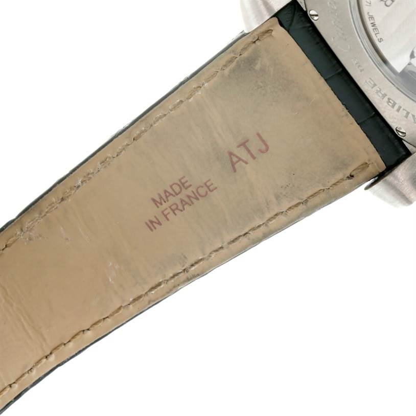 This image shows the underside of the leather strap and part of the case back of a Calibre de Cartier watch by Cartier.