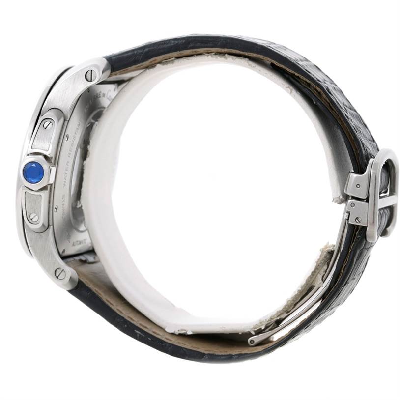The image shows a side view of a Calibre de Cartier watch by Cartier, highlighting the crown, straps, and buckle.