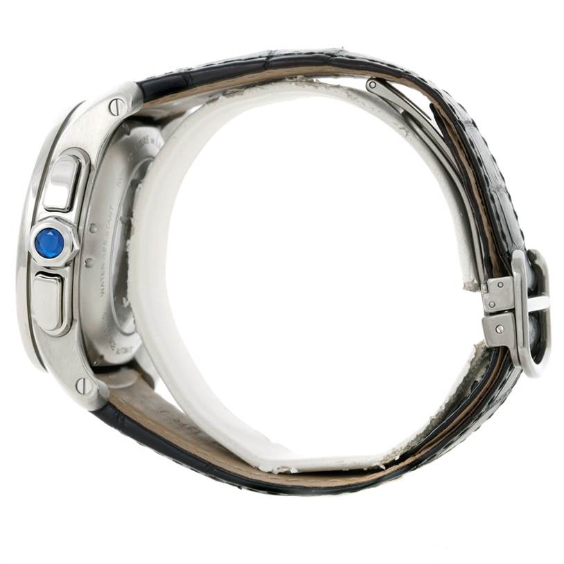 The Calibre de Cartier watch is shown from a side view, highlighting its bezel, crown, pushers, and part of the strap.