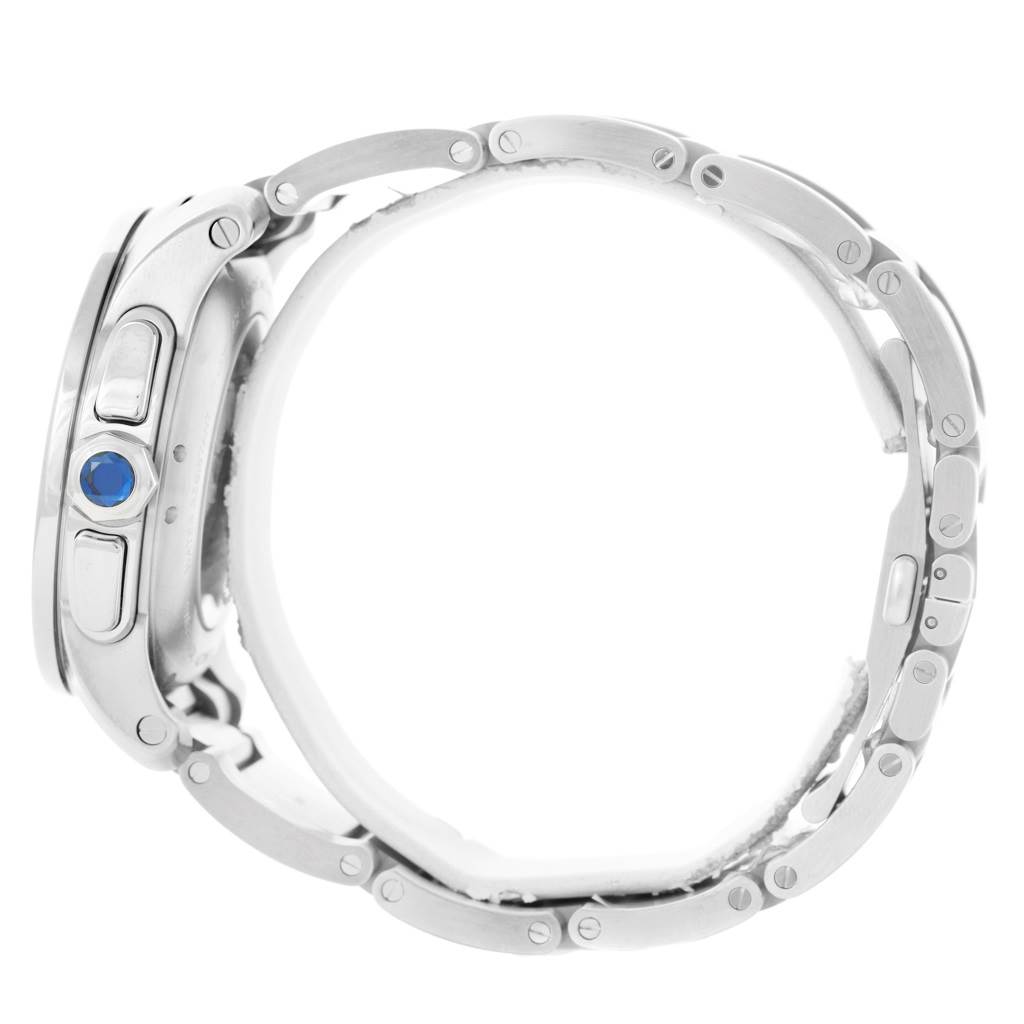 The image shows a Calibre de Cartier watch by Cartier from a side angle, focusing on the case, crown, and part of the metal bracelet.