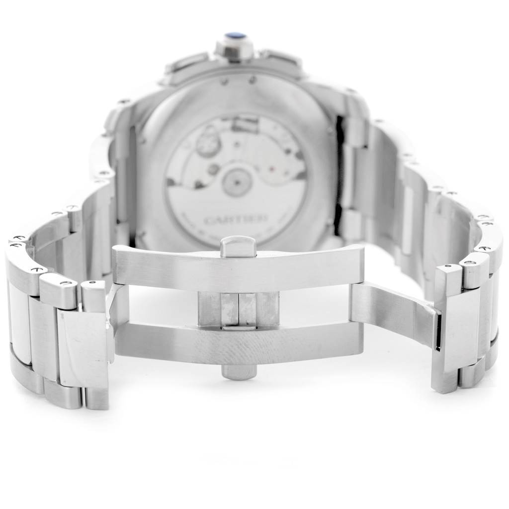 The image shows the backside and clasp of a Calibre de Cartier watch by Cartier, highlighting its stainless steel bracelet and mechanical movement.